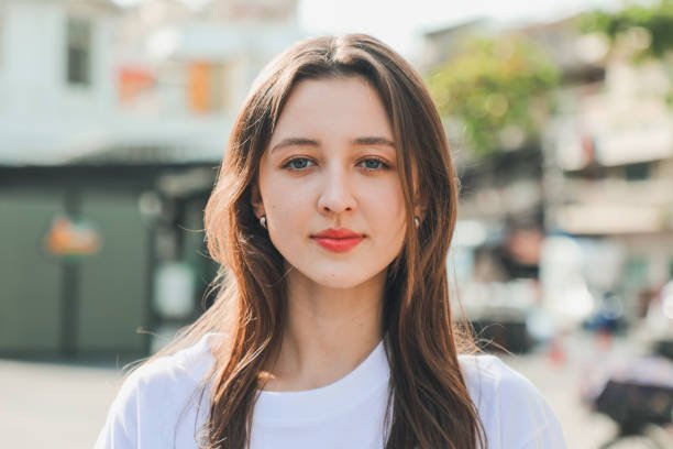 portrait of young white female looking to camera with cool attitude